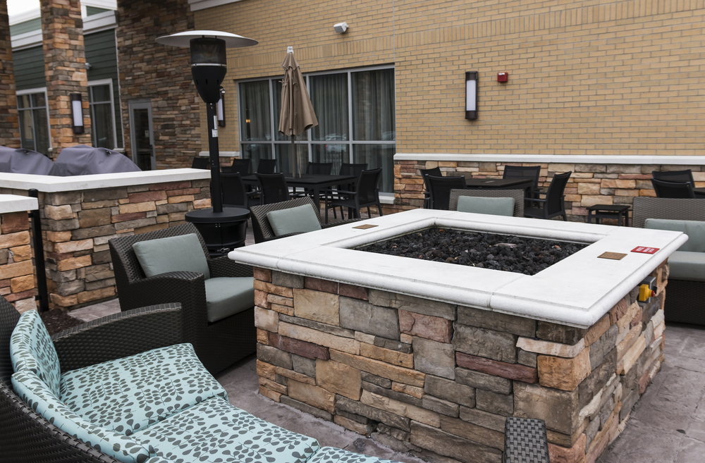 Custom made firepit by Carlos Pools & Landscaping part of our landscape design services